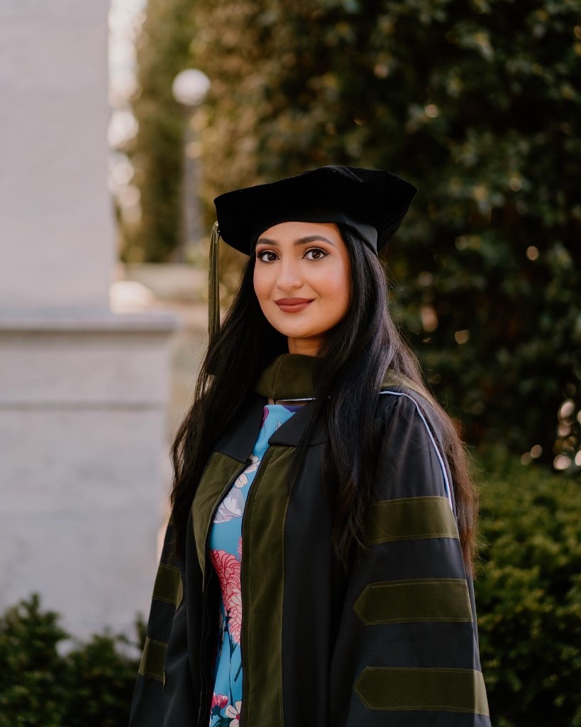 Dr. Sarah, PharmD, RPh in graduation cap and gown
